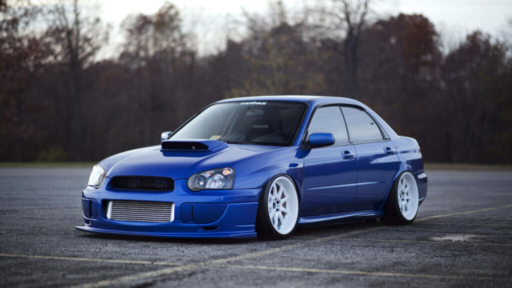 Sleek Subaru Impreza Wallpaper: Blue Stance Kit & Performance Wheels