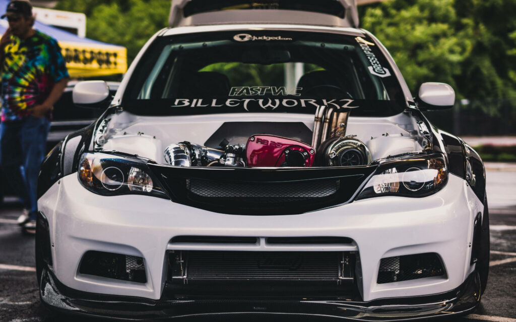 Sporty Subaru Impreza Wallpaper: Sleek Design & Open Engine Display