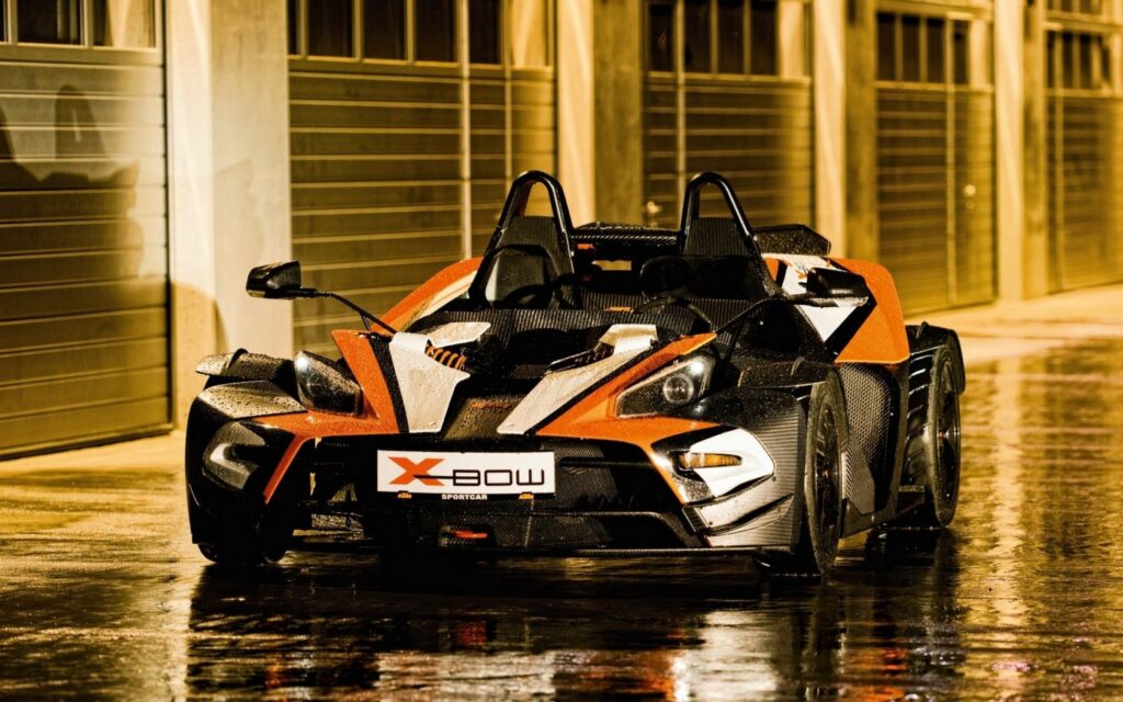 Sleek Supercar Wallpaper: Glistening in Ambient Light with Puddles