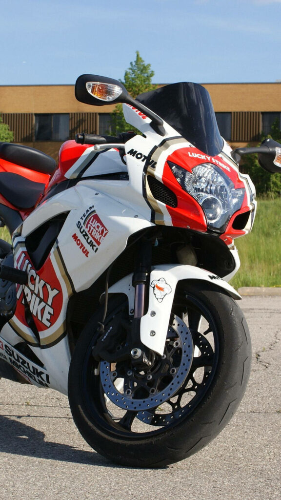 Sleek Suzuki Racing Bike Wallpaper: Vibrant Lucky Strike Design