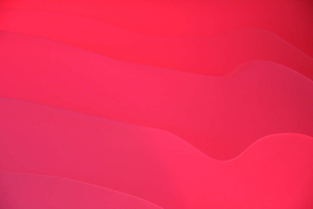 Modern Red Gradient Wallpaper with Flowing Curve Line Design