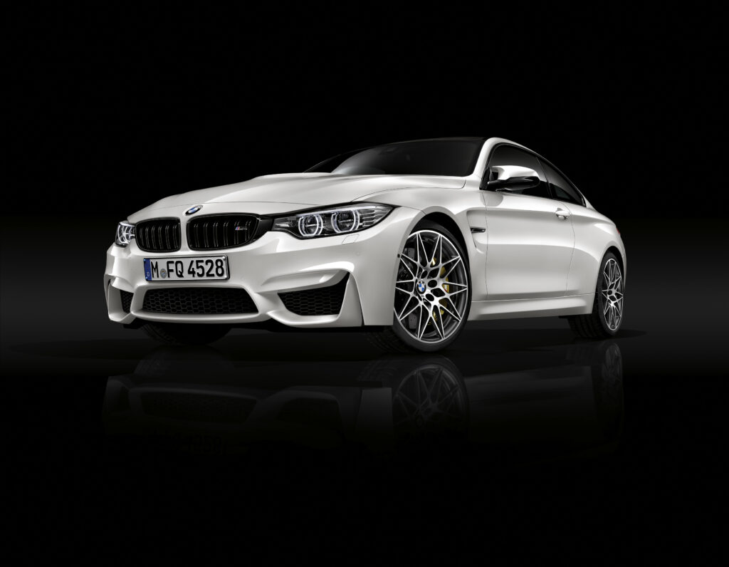 Sleek White BMW M4 Side View: Dynamic Design & Sporty Elegance Wallpaper