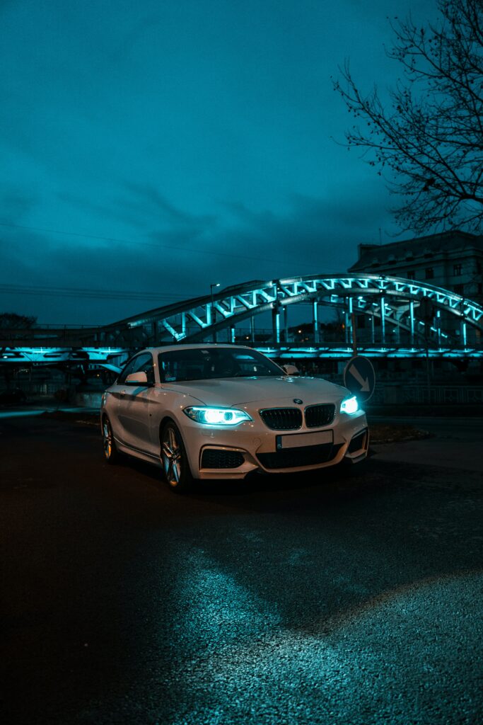 Striking White BMW in Blue Urban Setting - Sleek Design Wallpaper