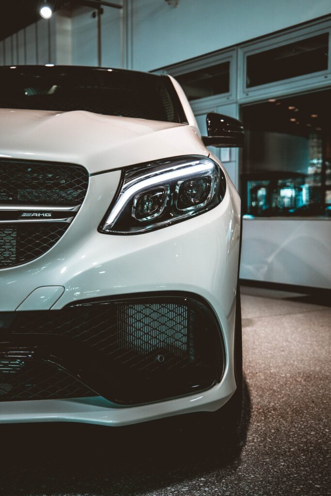 Sleek White Car Wallpaper: Stunning Front View & Elegant Headlights
