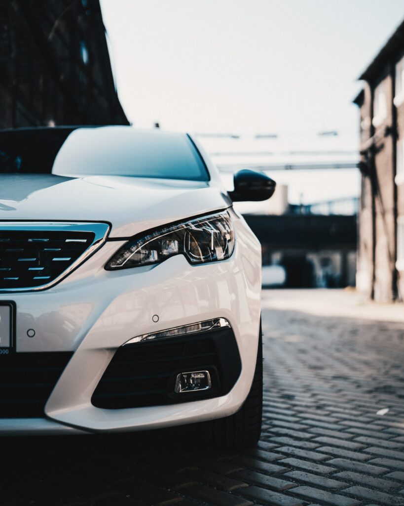 Stylish White Car Wallpaper: Modern Design & Urban Background
