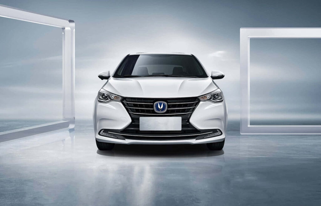 White Changan car front view in futuristic studio with sharp LED headlights and metallic finish Wallpaper