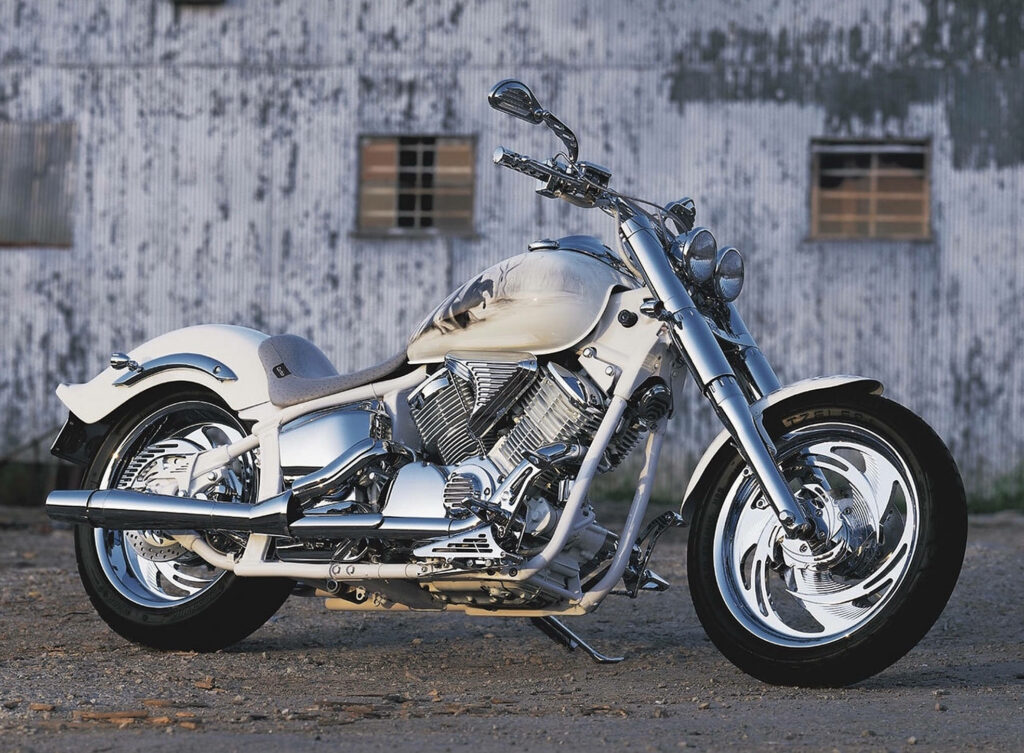 Sleek White Chopper Motorcycle Wallpaper in Rustic Industrial Setting