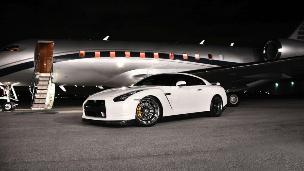 Sleek GT-R Sports Car & Private Jet: Luxury Wallpaper Background