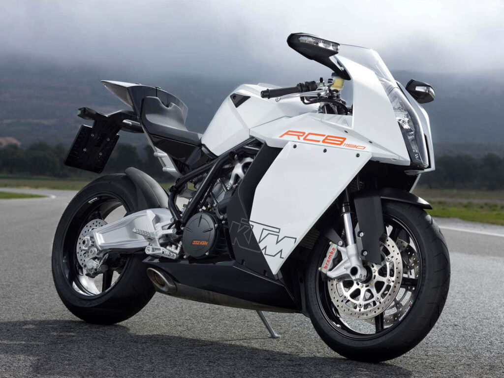 Sleek White KTM RC8 Motorcycle Wallpaper on Open Road