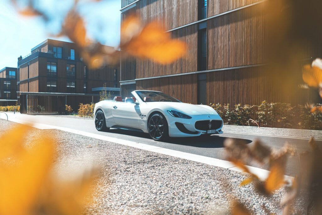 Sleek White Maserati GranTurismo Convertible on Sunlit Street Wallpaper