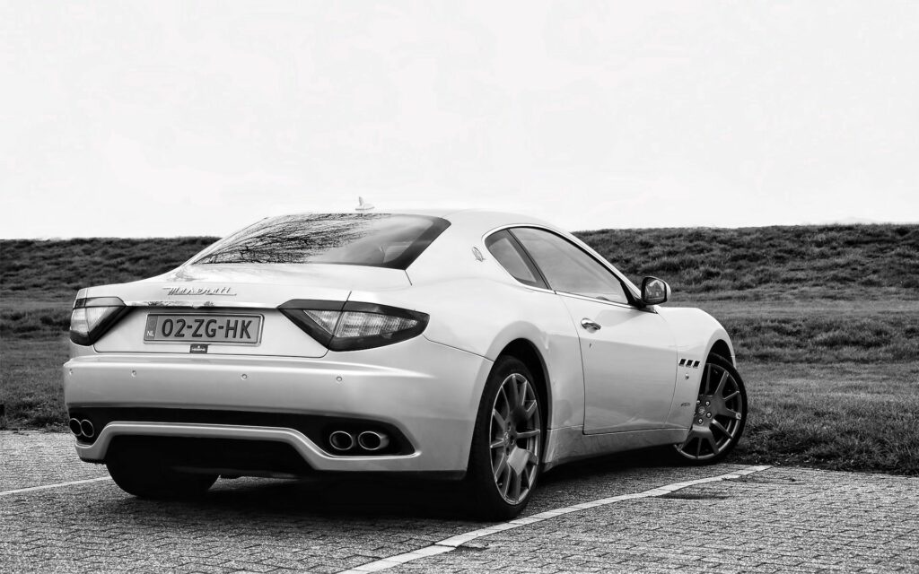 Sleek White Maserati Rear View: Luxurious Street Wallpaper