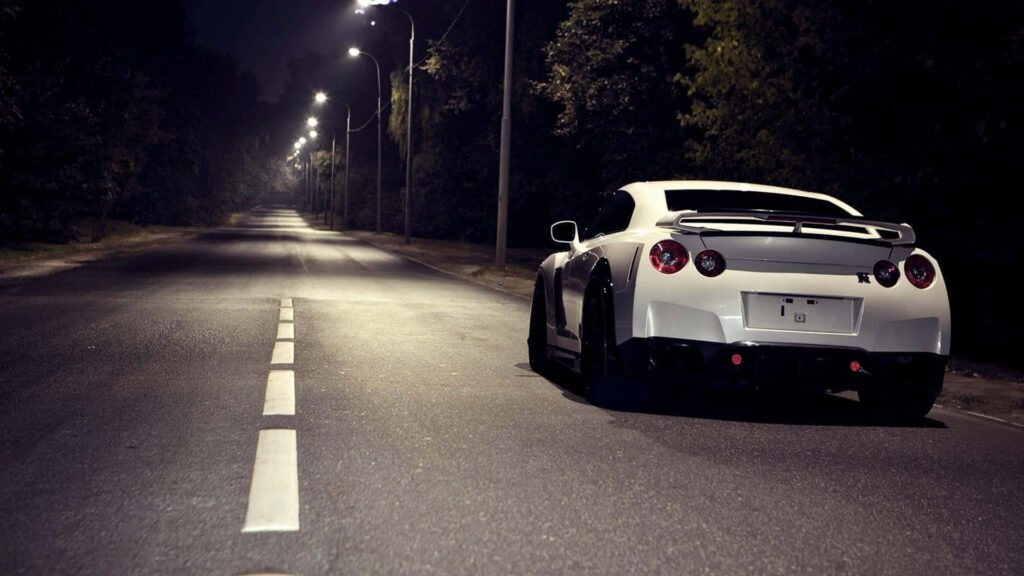Sleek White Nissan GT-R Night Wallpaper: Speed & Power Unleashed