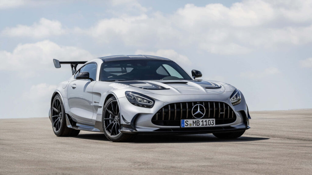 Stunning Wallpaper: Sleek White Mercedes-AMG GT Against Serene Sky