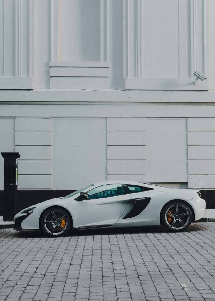 Stylish White Sports Car Wallpaper with Minimalist Background