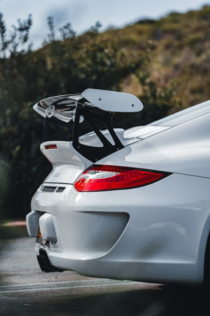 Sleek White Sports Car with Spoiler - High-Res Wallpaper 4000x6000