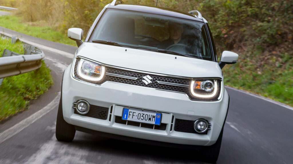 Sleek White Suzuki Ignis in Action: Modern Design Wallpaper