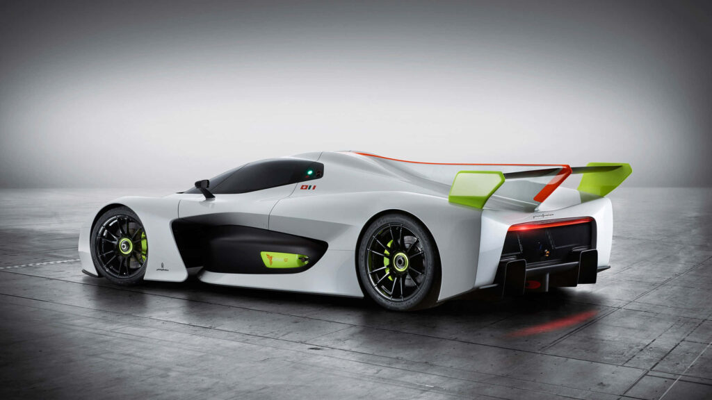Sleek white green racing car under dramatic light showcasing aerodynamic modern design wallpaper