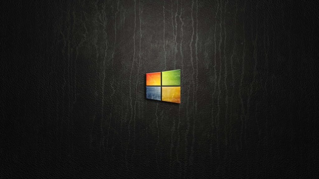 Windows logo with worn texture on dark leather background minimalist sleek wallpaper design
