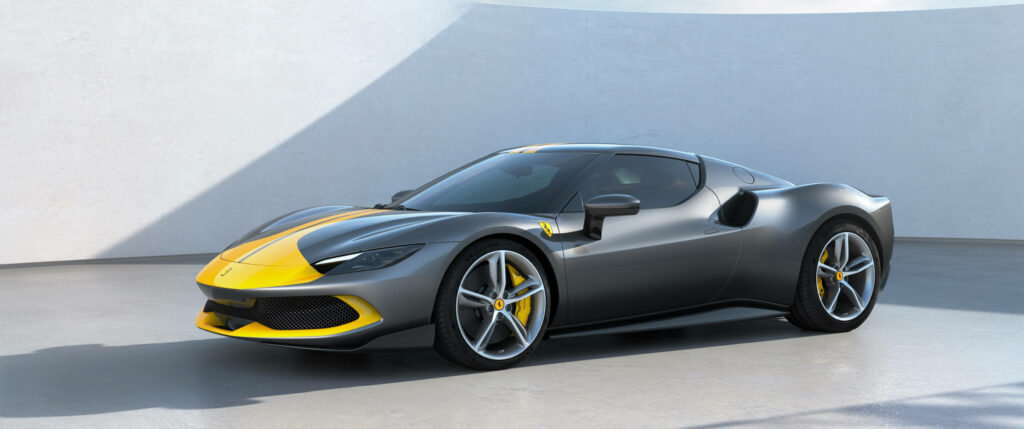 Front view of sleek yellow and grey Ferrari sports car with modern aerodynamic design wallpaper