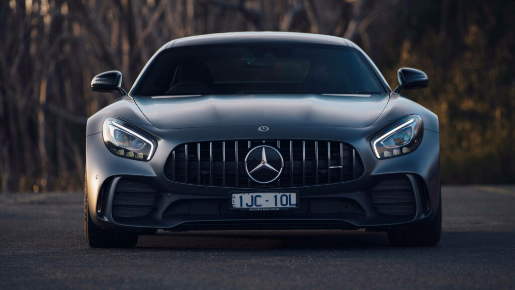 Sleek and Sophisticated: Front View of a Black Mercedes-Benz Sedan in 4k Wallpaper