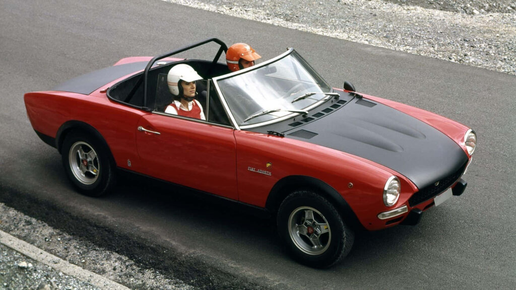 Roaring Red: Captivating Abarth Racing Car at Full Speed! Wallpaper