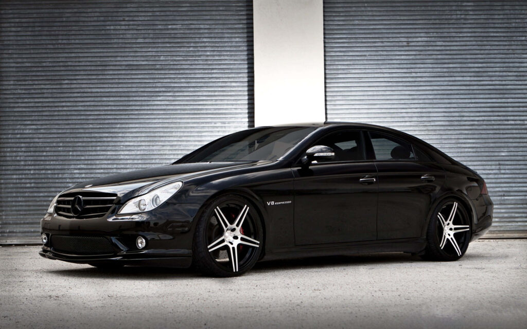 Midnight Marvel: Stunning Side View of Black Mercedes as Striking Wallpaper
