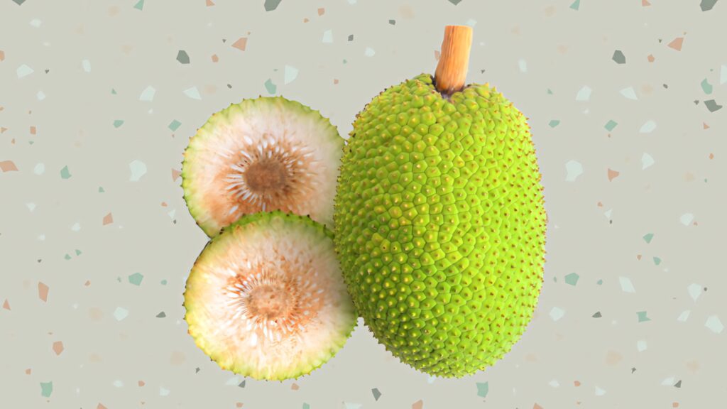Sliced green breadfruit with textured interior on soft terrazzo background tropical wallpaper