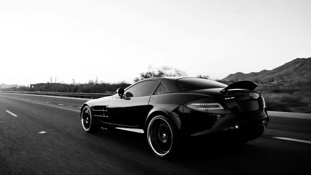 Monochrome Motion: High-Definition Mercedes Benz SLR Racing Down the Road Wallpaper