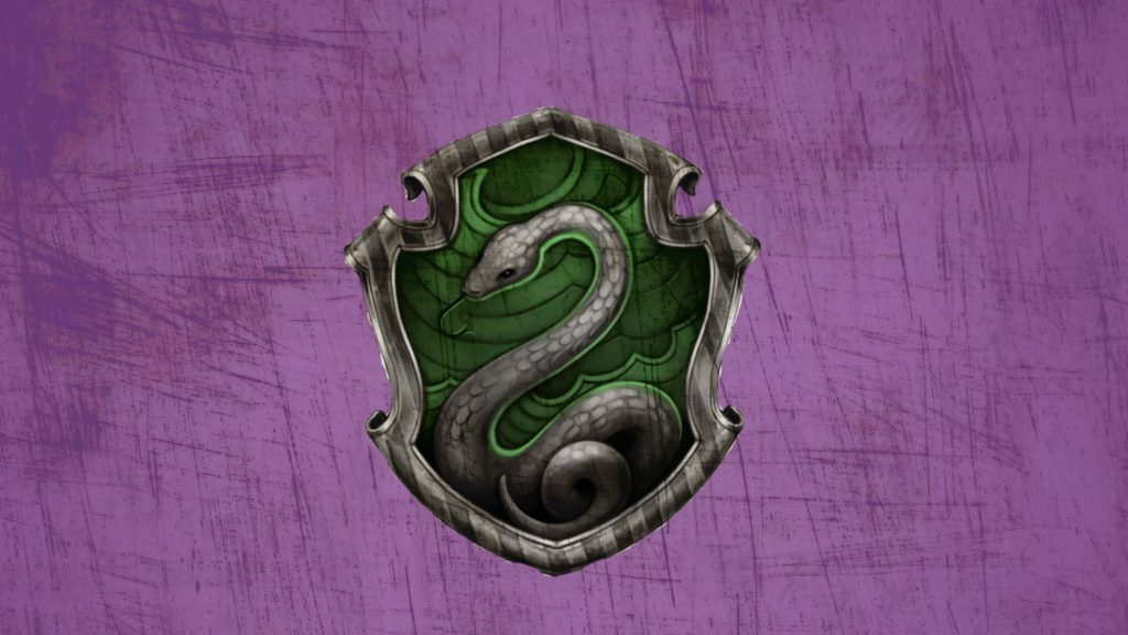 Slytherin crest silver snake on dark green shield textured purple Harry Potter wallpaper background