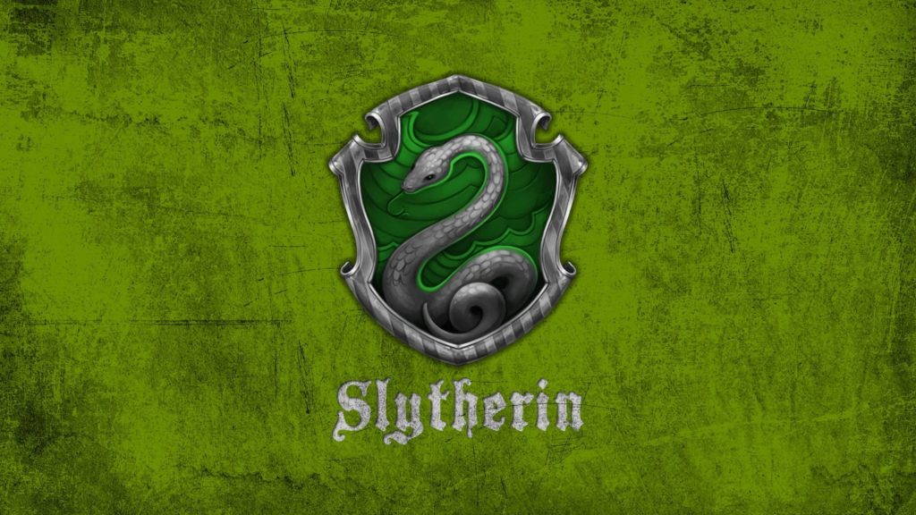 Slytherin wallpaper with silver serpent crest on deep green textured background Harry Potter fan