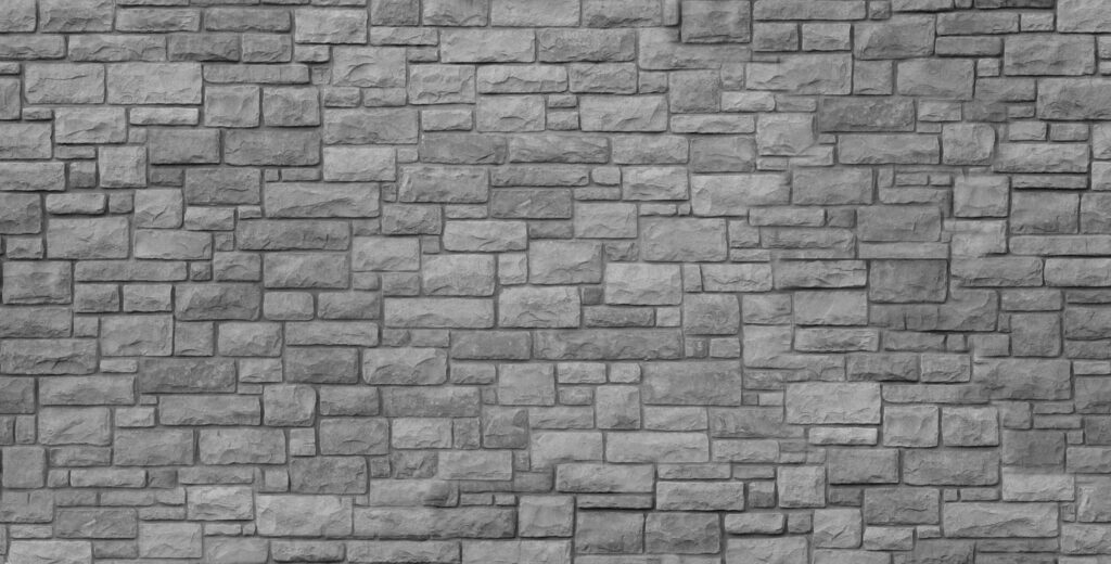 Brick by Brick: A Small Stone Wall Texture Wallpaper for a Rustic Background Photo