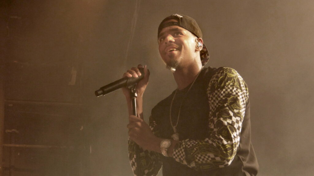 Joyful J Cole: Embracing Music with a Smile in 4K Wallpaper