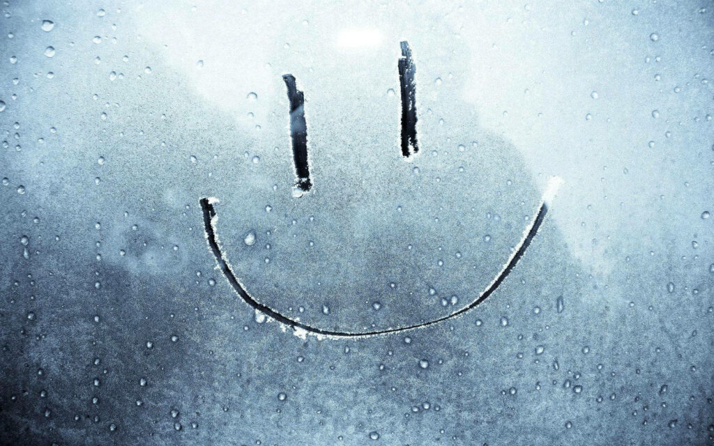 Smiling through the Fog: A Happy Wallpaper Moment in Glass Panel