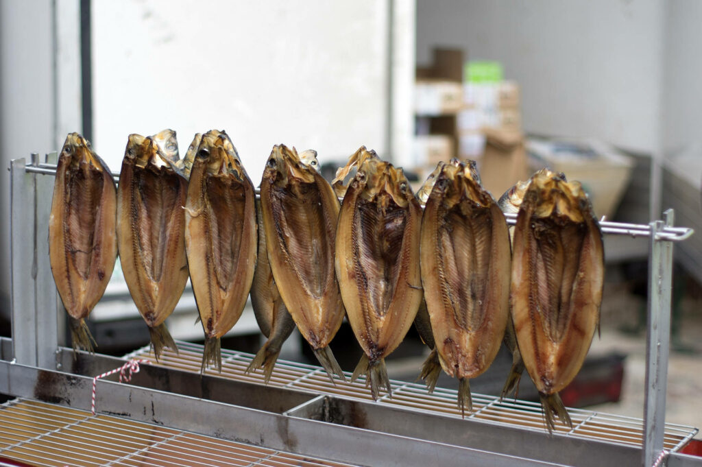 Golden-Brown Smoked Boneless Herring: Culinary Wallpaper Background