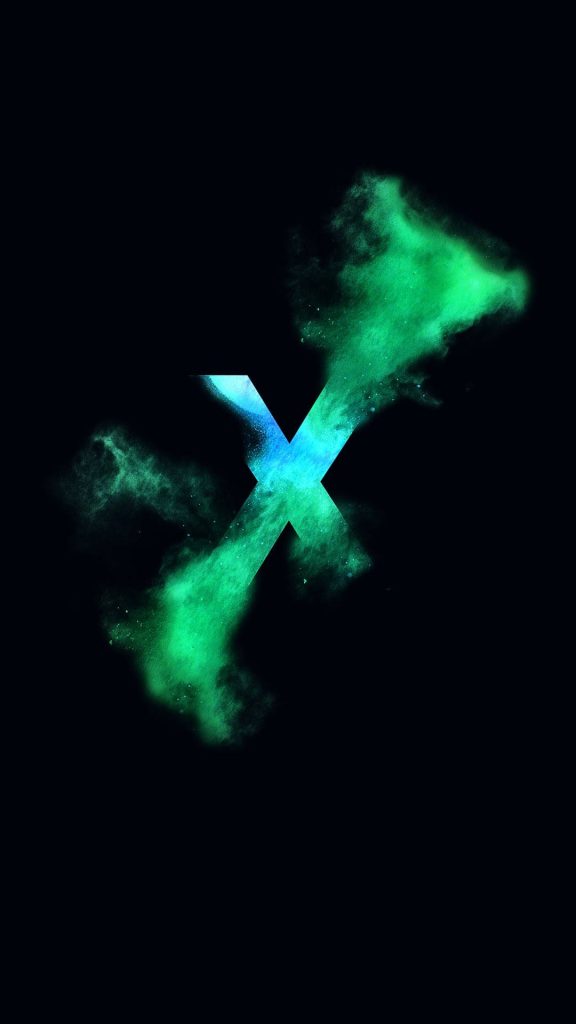 Glowing neon green cyan letter X with powder explosions on black minimalist wallpaper background
