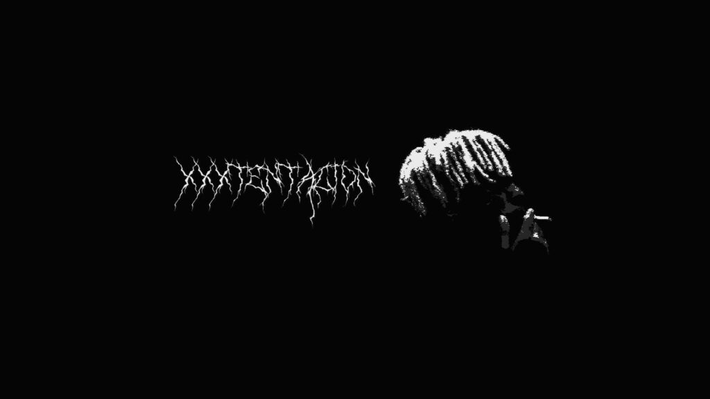 Garbled Icon: Embracing Xxxtentacion's Smoke-Filled Persona on Your Desktop Wallpaper
