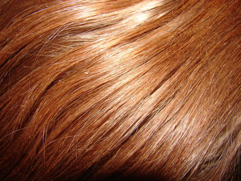 Shiny Brown Textured Hair Close-Up Wallpaper Background