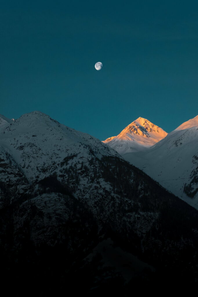 Majestic Snowy Peaks under the Twilight Moon: HD Phone Wallpaper Background