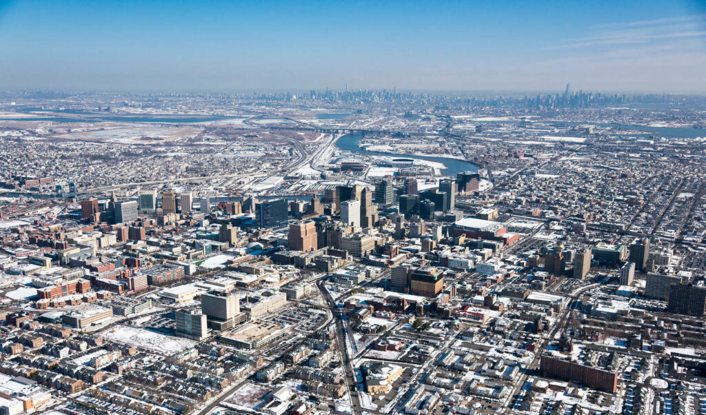Stunning Aerial View of Newark, NJ: Urban Landscape & Snowy Rooftops Wallpaper