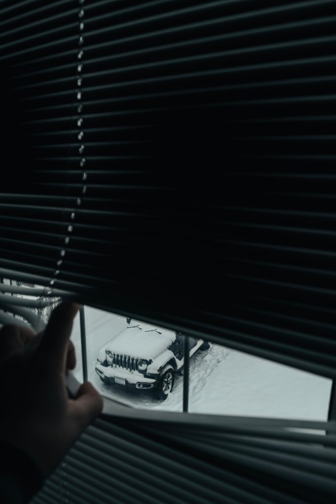 Snowy Winter Scene Through Window Blinds - Cozy SUV View Wallpaper