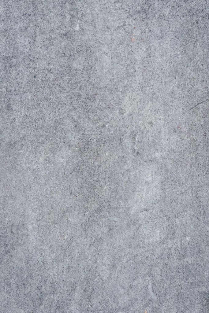 Microcement concrete wallpaper with matte finish and realistic soft grey industrial texture background