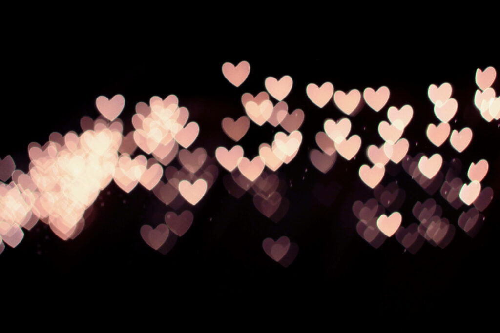 Dreamy Heart-Shaped Bokeh Wallpaper on Dark Background