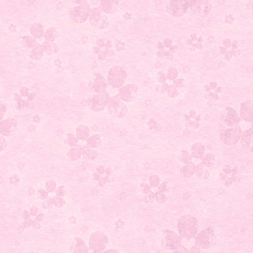 Soft pink wallpaper with heart-centered five-petaled flowers on textured pastel background