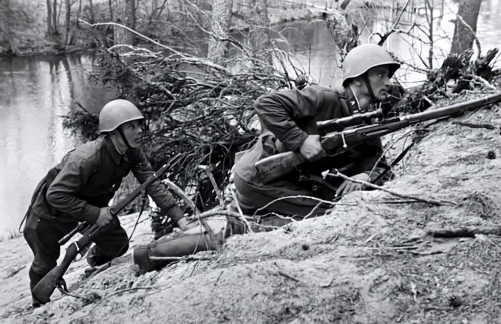 Soldiers on High Alert in Forested Military Scene – Historical Wallpaper