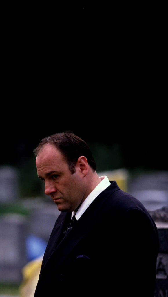 Solemn Man in Suit at Cemetery | Dramatic Sopranos Wallpaper