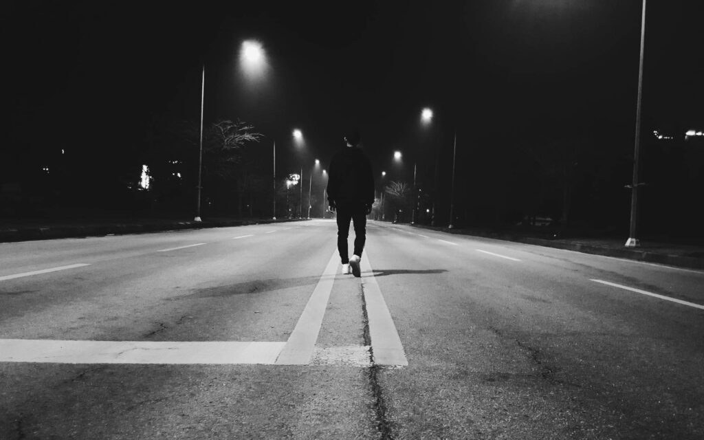Lost in Solitude: Dark Night and the Empty Road - Captivating Lonely Shot Wallpaper