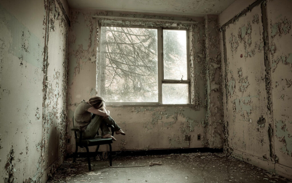 The Loneliness Enveloping the Abandoned Room: A Solemn Portrait of Solitude Wallpaper