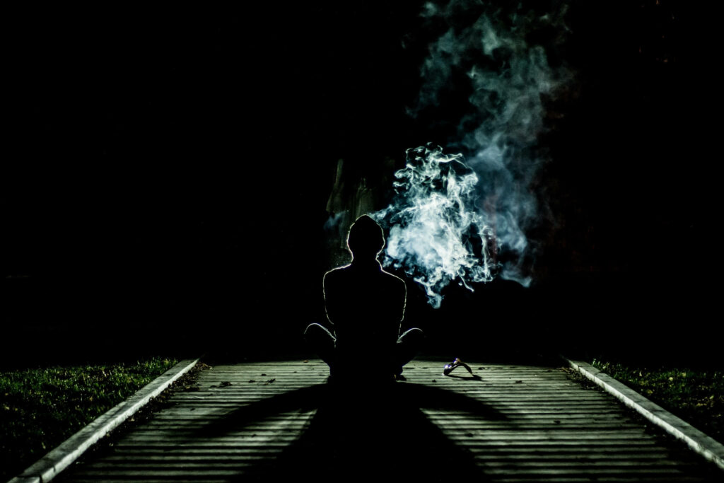 The Solitary Smoker: Captivating Silhouette on the Pathway, Ideal Phone Wallpaper