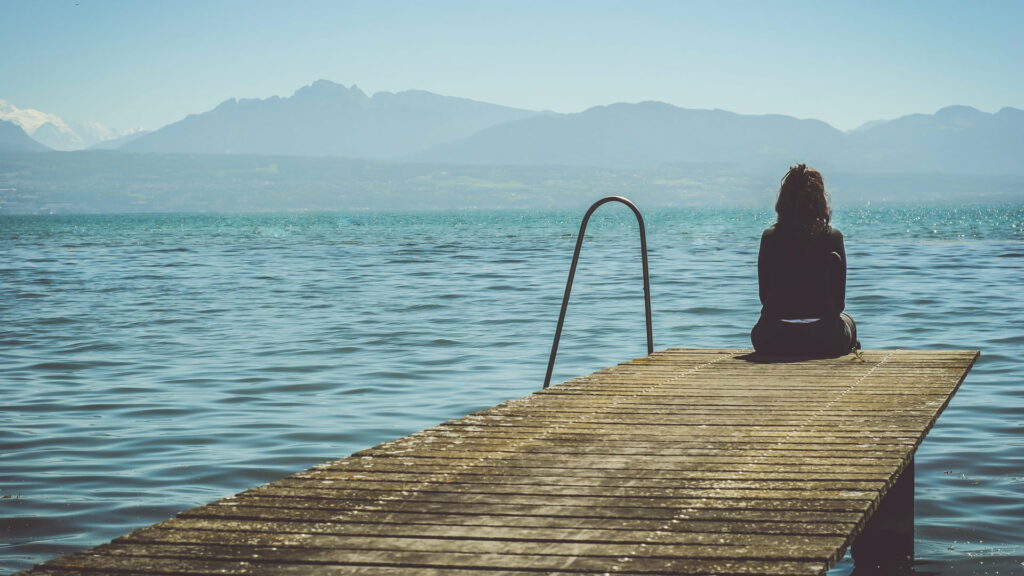 Solitude on the Dock: A Captivating HD Wallpaper of a Lonely Girl Fighting Depression