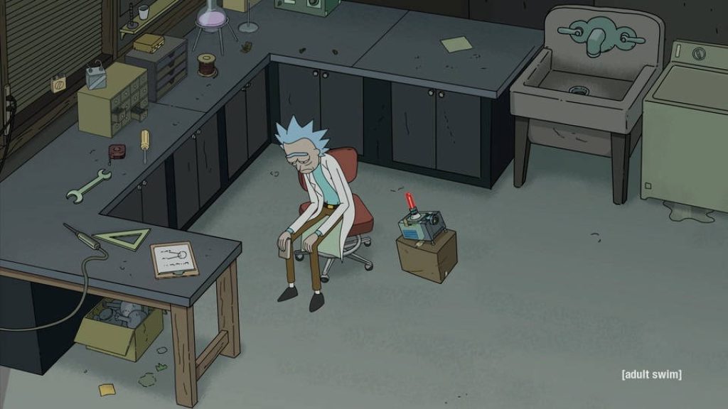 Somber Rick Sanchez in messy garage lab 2D animated Rick and Morty wallpaper background